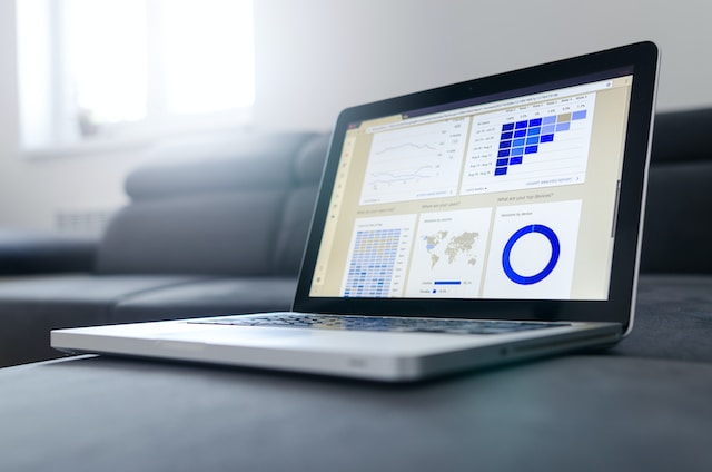 Laptop opened to Google analytics report for website audit