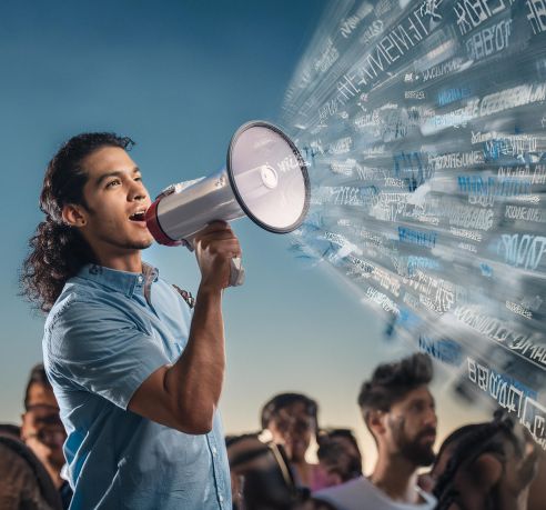 Speaking to a crowd through a megaphone