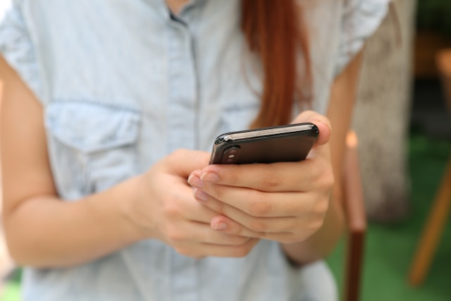 person receiving sms message on mobile phone
