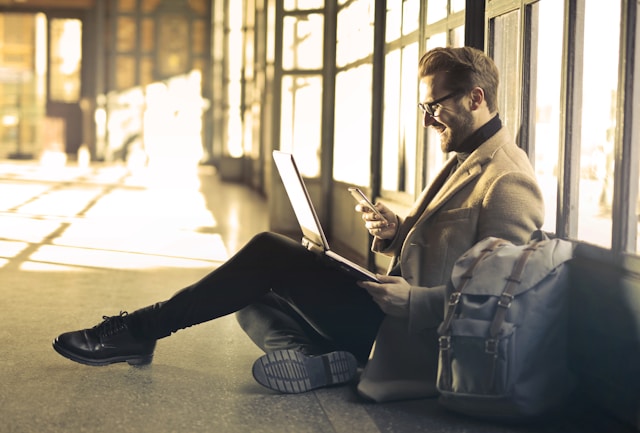 Man responding to email and sms text messages