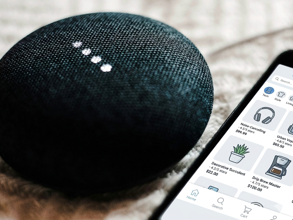 Amazon Alexa next to a smartphone ecommerce app